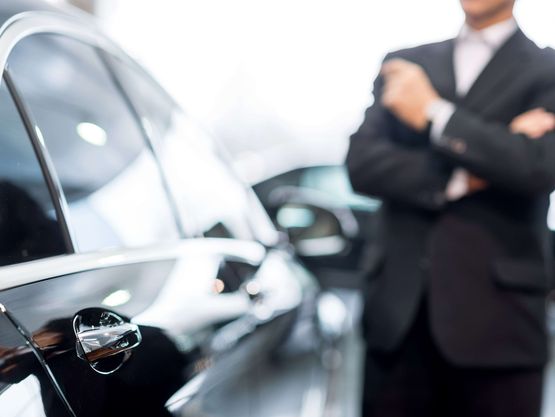 Our smartly-dressed chauffeur with one of our vehicles in Hampshire